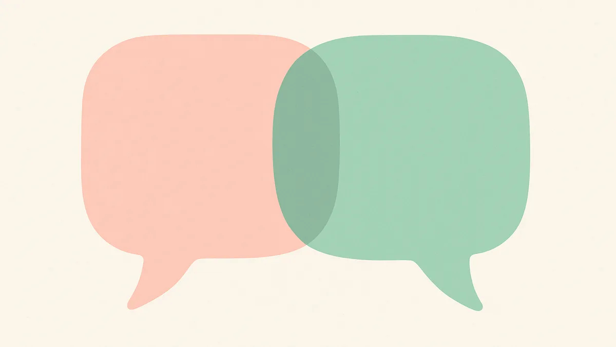 Two speech bubbles overlapping gently, representing two languages coexisting